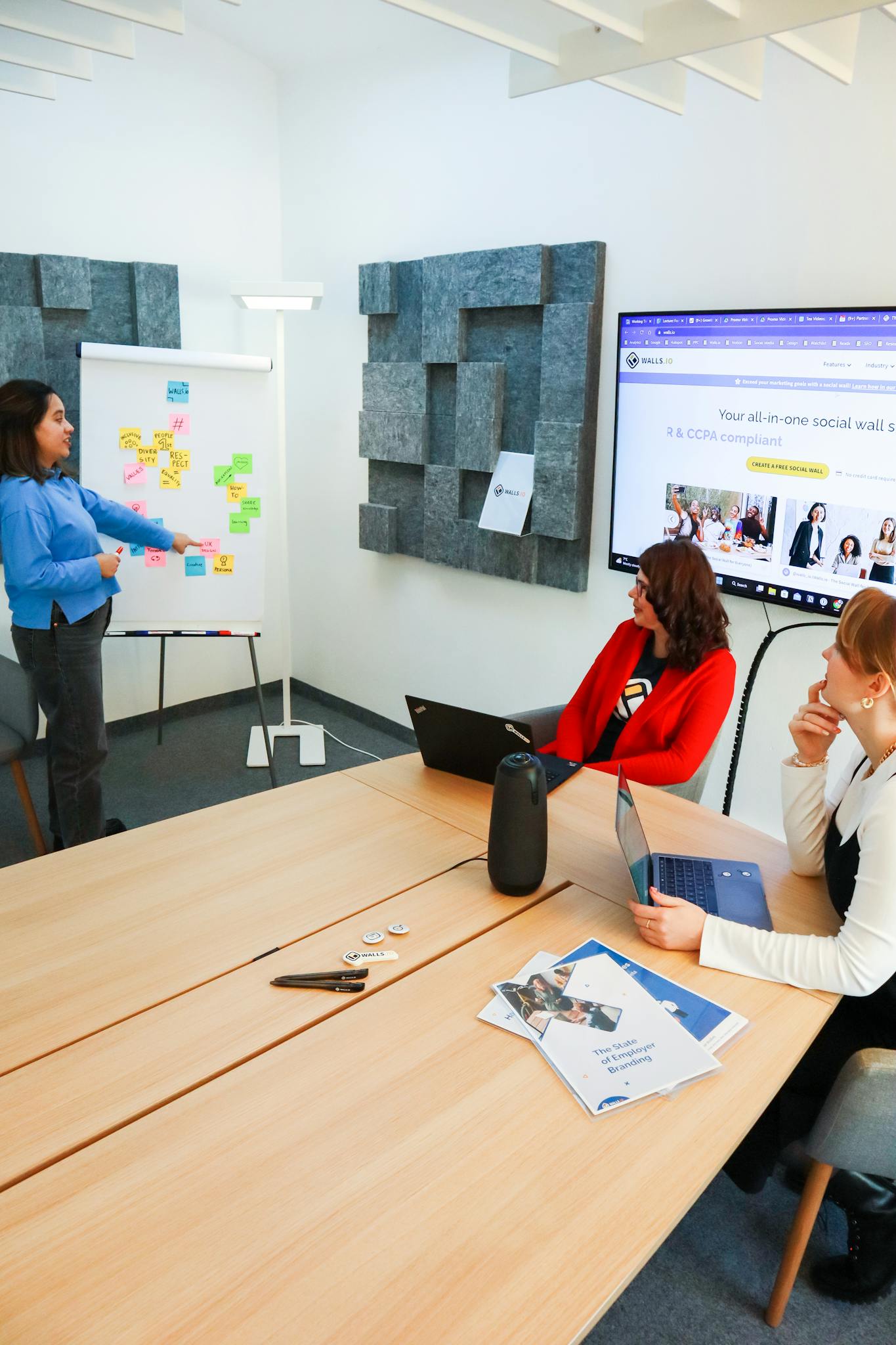 Women collaborating on business strategies during a modern office meeting.